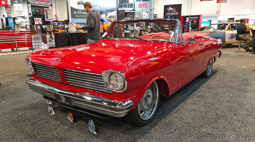 We spotted this interesting 1963 Nova SS in the RBS Coatings booth. Built by Cool Hand Customs, it had a TREMEC Magnum 6-speed transmission bolted to an LS V8 that was nestled in an aftermarket front subframe. The Canadian Acadian front grille is an interesting detail that sets it apart from common US Chevy IIs. 