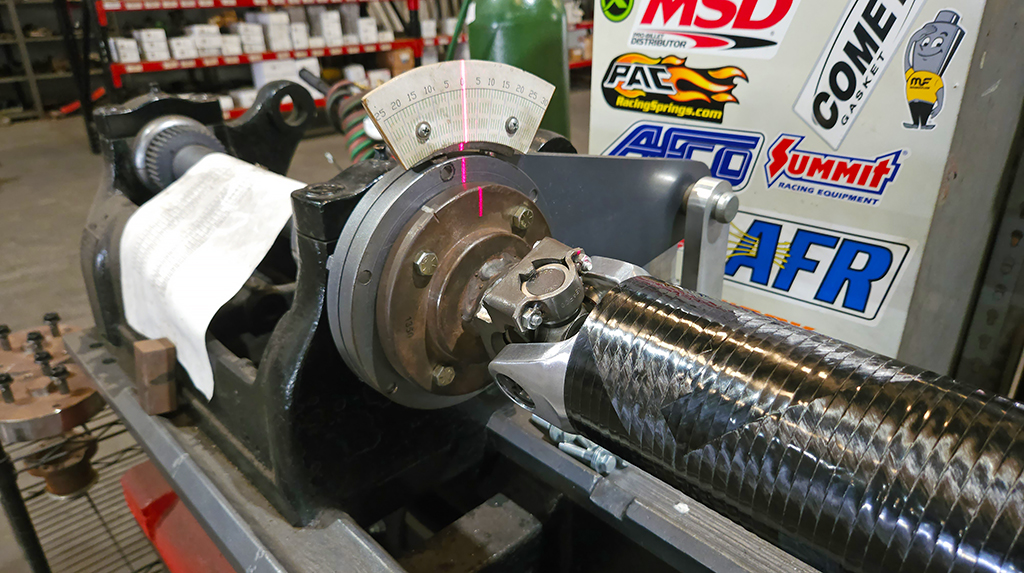 Both ends are monitored via laser for twist rate and deviation during torque test to verify the yoke ends are bonded in place properly. Gulfcoast Driveshaft is one of the few driveshaft companies that offers this type of torque testing using a special fixture built in-house. A carbon fiber driveshaft has a bit of torsional flex, so under load it will twist a small amount and rebound when the torsional force reduces. For drag cars in particular this helps with initial launch and can improve 60-foot times. For manual transmission drag cars this bit of rebound helps as the clutch is released and the engagement drags engine RPM down. 