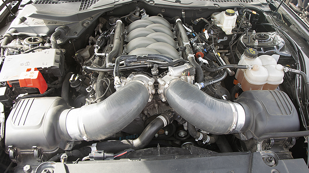 An overhead picture of the 5.0L Coyote V8 in Jesse Rodriguez's 2024 Ford Mustang GT