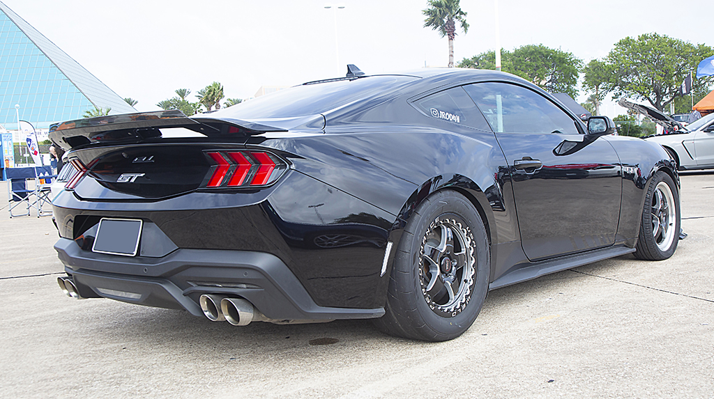 Rear three quarter angle view of Jesse Rodriguez's 2024 Ford Mustang GT at Mustang Week Texas 2024