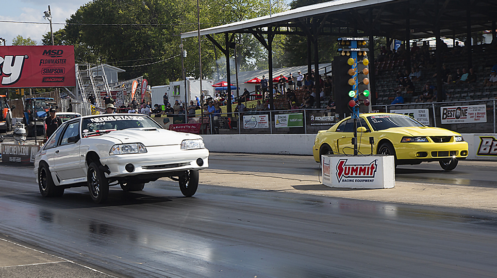 A Fox Body Ford Mustang drag races against a New Edge Ford Mustang Cobra at Beech Bend Raceway as part of the TREMEC Stick Shift Shootout at the 2025 Holley Ford Fest