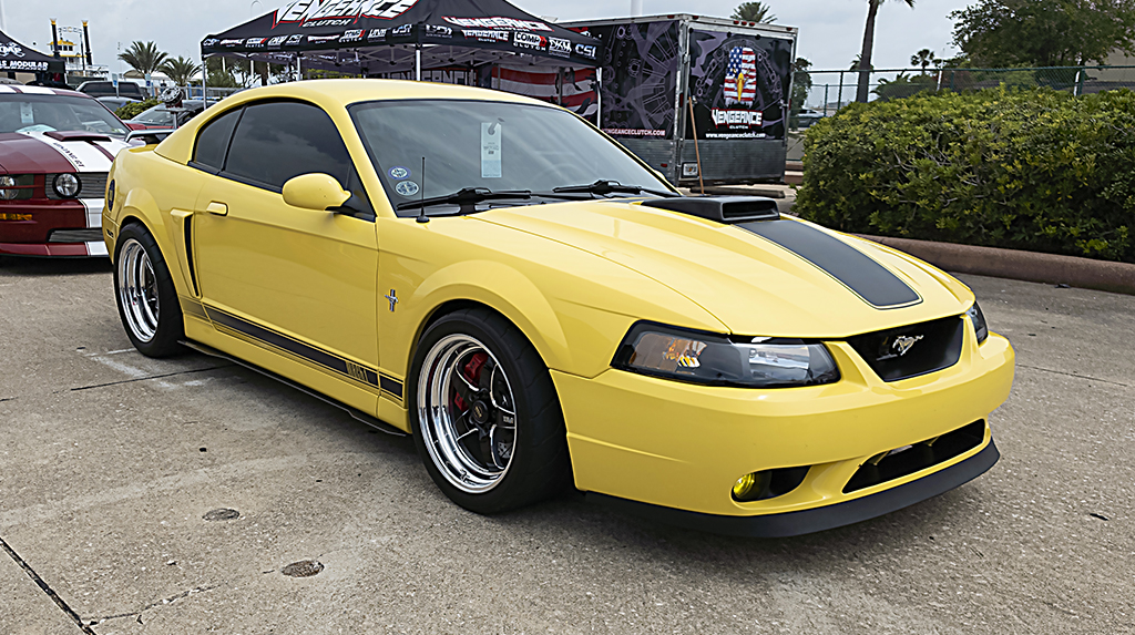 A yellow 2003 Ford Mach 1 Mustang front three-quarter photo