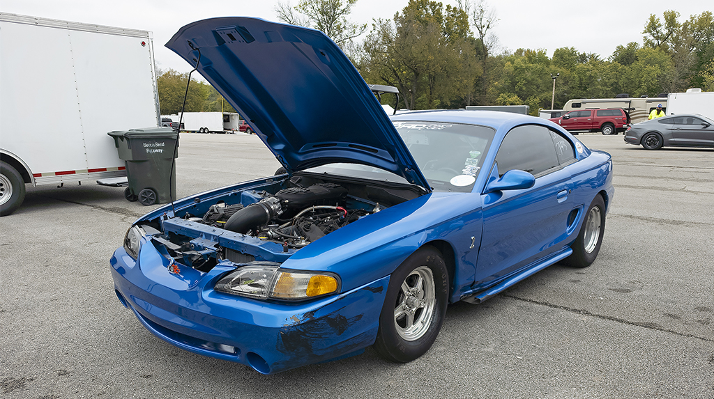 A 1998 Ford Cobra Mustang showing damage from a near rollover accident on the dragstrip at Beech Bend Raceway