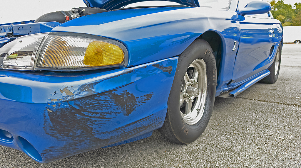 The front bumper of 1998 Ford Cobra Mustang showing damage from a near rollover accident on the dragstrip at Beech Bend Raceway