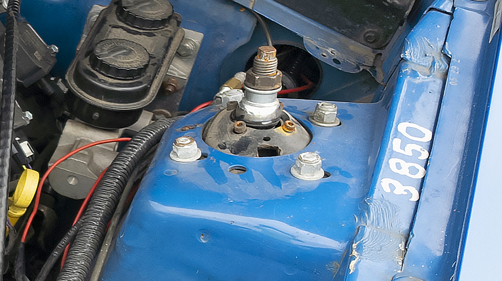 A 1998 Ford Cobra Mustang showing damage to the caster camber plate from a near rollover accident on the dragstrip at Beech Bend Raceway