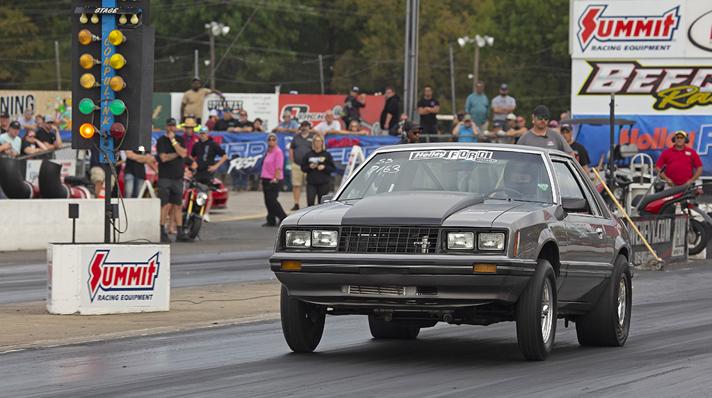 1981 Ford Mustang drag racing at Beech Bend Raceway goes past the starting line Christmas Tree