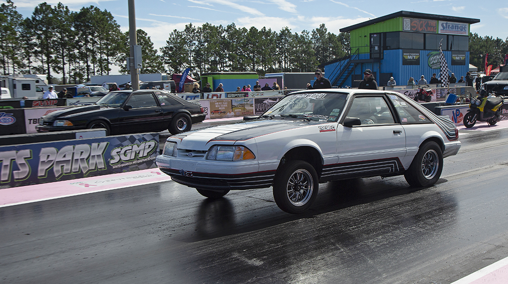 A Ford Fox Body Mustang launches from the starting line during True Street competition during the 2026 Mod Motor Nationals